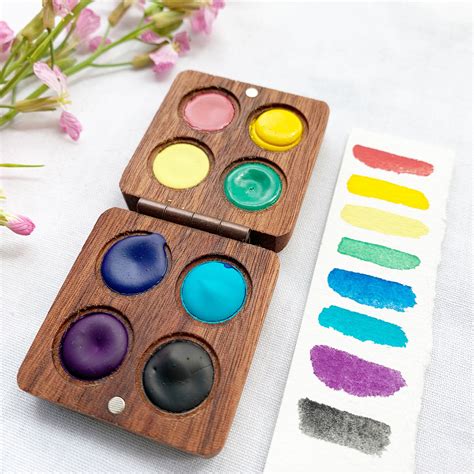 Wooden watercolor palette with paints